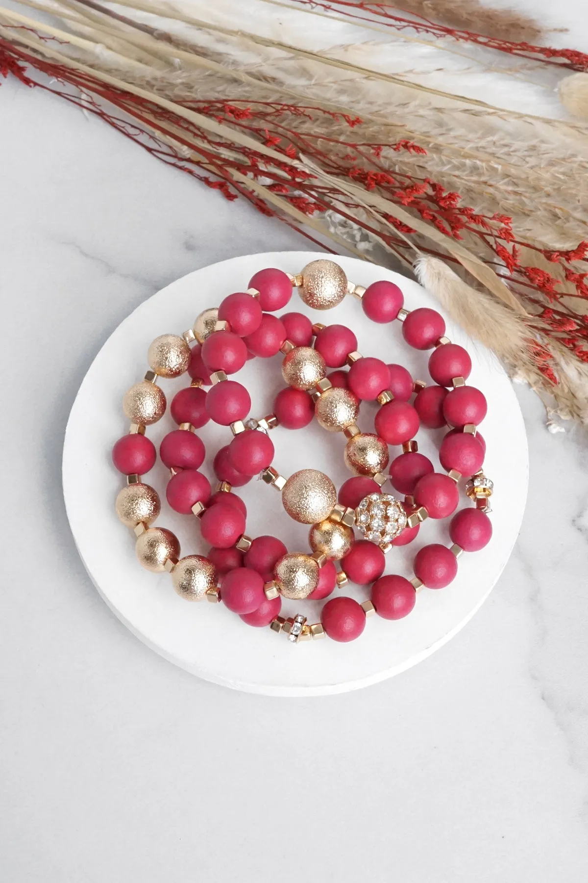 Beaded bracelets set in Red and Gold with clear crystals